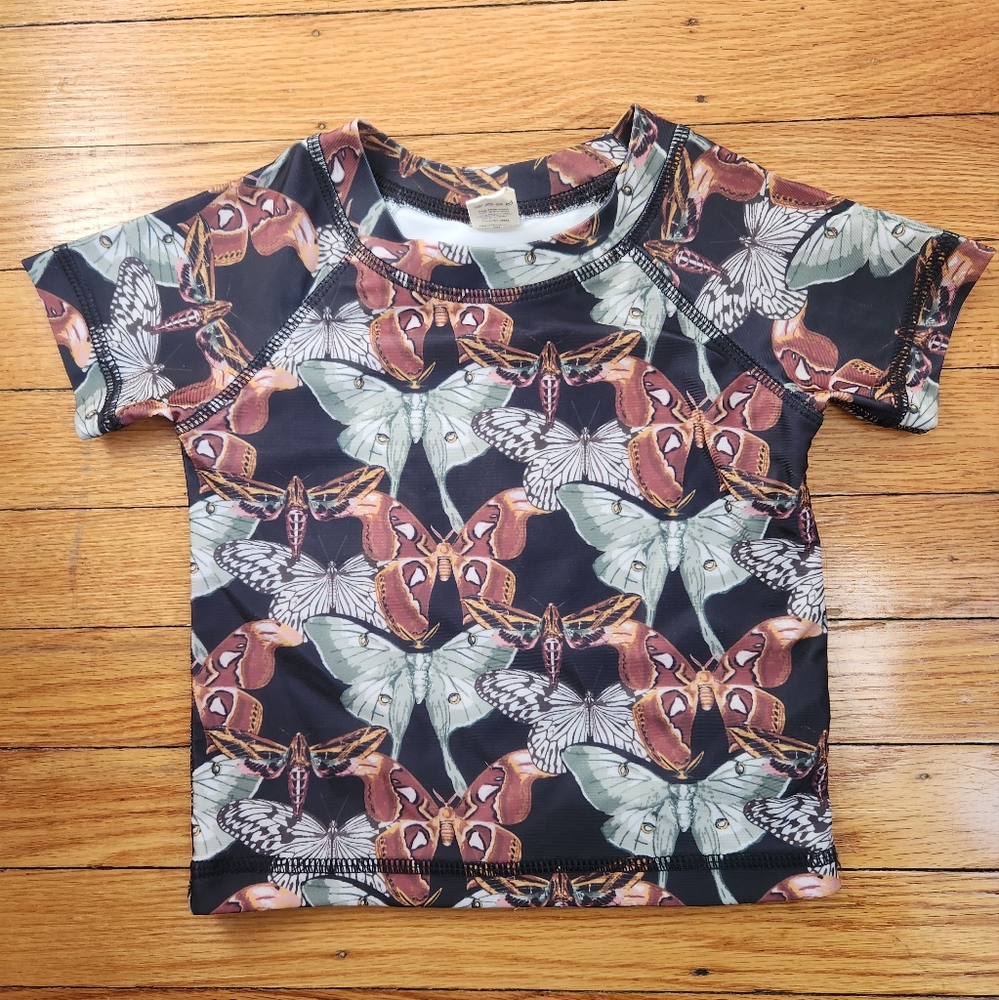 Kate Quinn Black and Brown Rashguard Swim Top